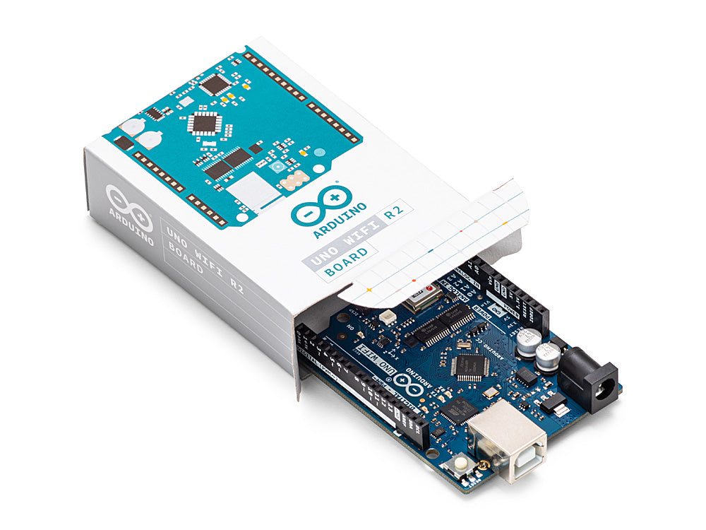 Arduino Uno WiFi Rev2 board displayed alongside its packaging contents, including the branded product box