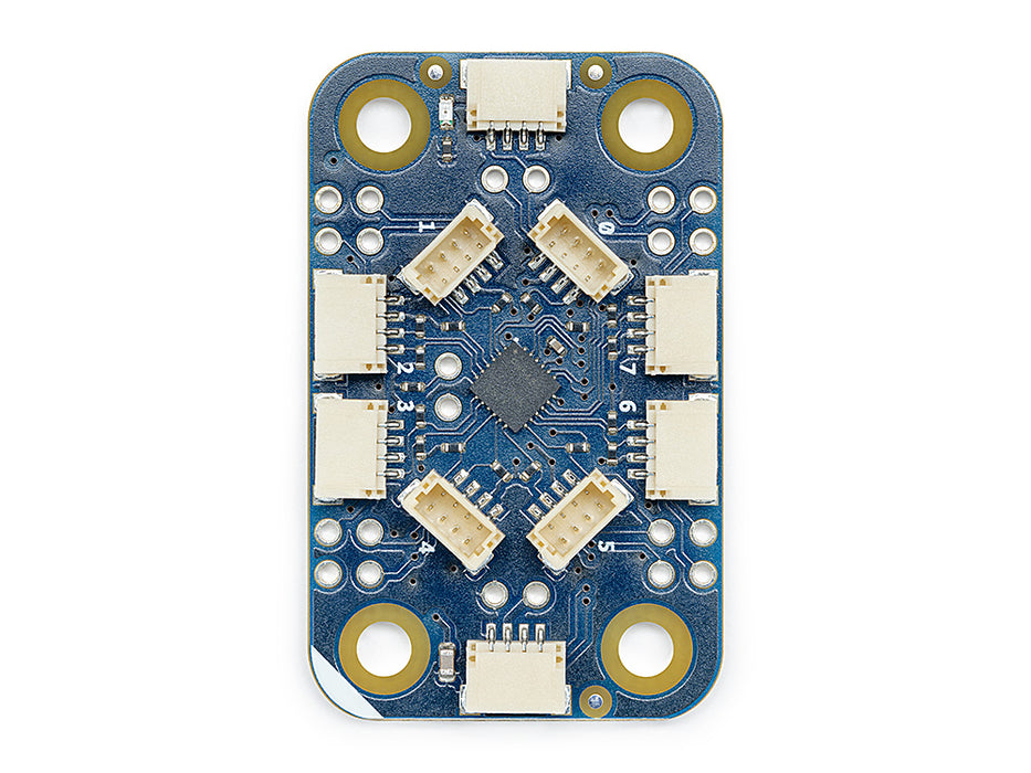 Top down view of the Arduino Modulino Hub expansion board, featuring multiple plug-and-play I2C connectors on a compact black PCB.
