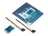 Unboxed Arduino Modulino Extender circuit board resting next to its official branded anti-static packaging pouch, illustrating the compact scale of the I2C extension module.