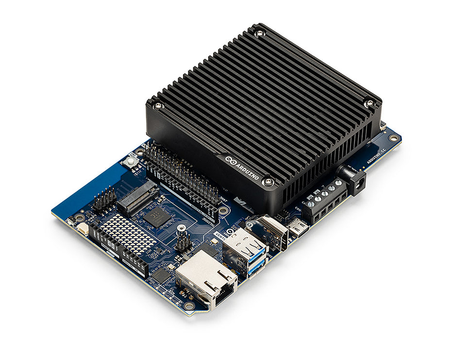 Perspective view of the Arduino Ventuno Q board showing the blue PCB, black heatsink with logo, USB, HDMI, and Ethernet ports.