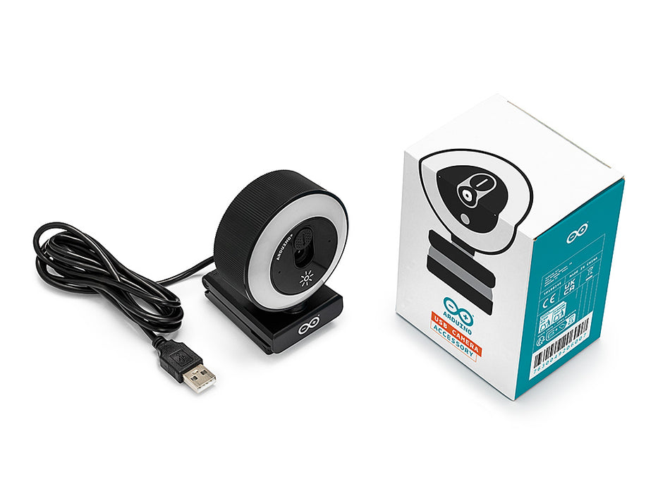 Unboxed Arduino USB Camera beside its white and teal retail box, showing the webcam with illuminated LED ring, monitor clip base and coiled USB-A cable.